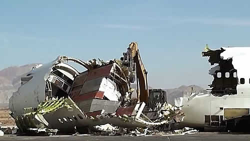 Airliner being crushed into smaller pieces for recycling